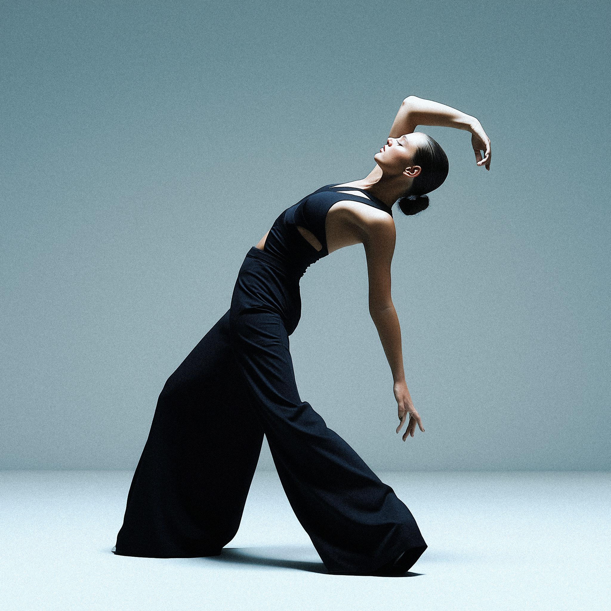 jay770282_A_graceful_studio_photo_of_a_female_dancer_arching_he_15437346-4eeb-4103-a784-4bdf69336bbd